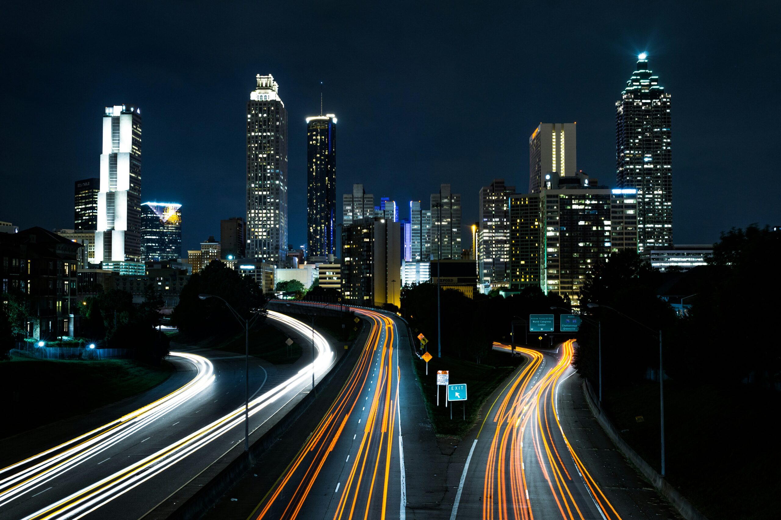 highways and a city skyline at night